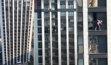 Meanwhile In Russia: Woman Casually Cleans Her Windows From The Ledge Outside Of 17th Story