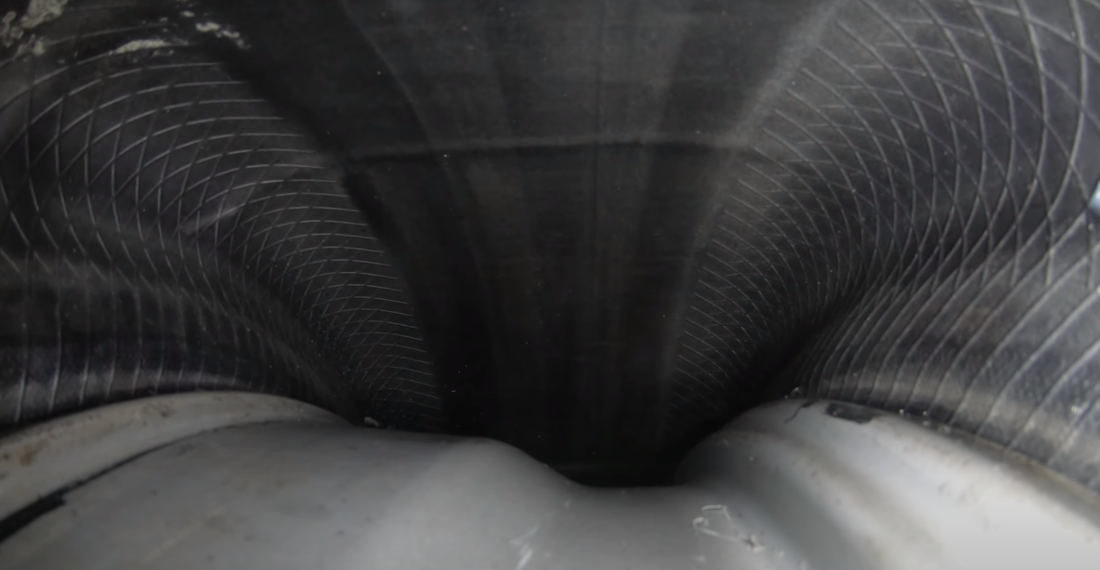 View From Inside A Car Tire As It’s Driving On The Road