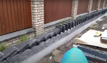 The Ol’ Domino Effect Method Of Setting A Stone Wall Top