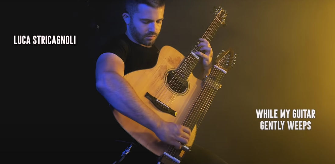 Guitarist Performs The Beatles’ ‘While My Guitar Gently Weeps’ On Acoustic Guitar With Slide Guitar Neck Attachment