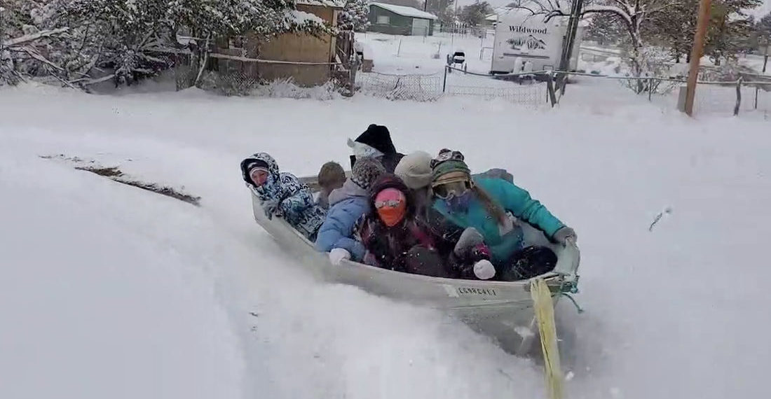 Sure, Why Not?: Kids Sledding In A Boat Pulled Behind ATV