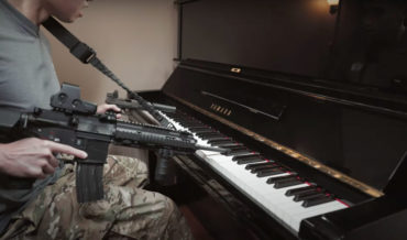 Performing The Star-Spangled Banner On Piano With An AR-15 And Pistol