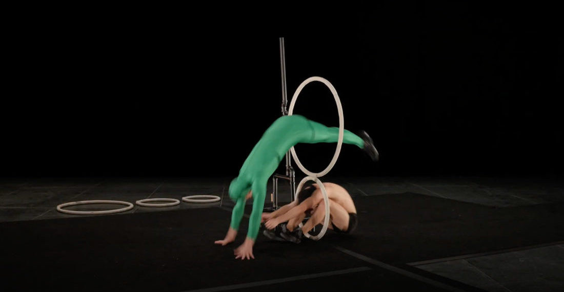 Acrobatic Troupe’s Skillful Jumping Through Hoops Routine