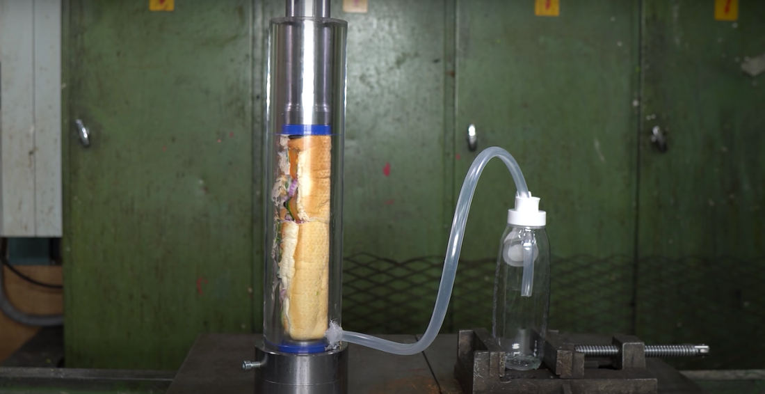 Yum: Smashing A Subway Footlong Into A Smoothie Using A Hydraulic Press