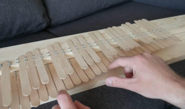 Guy Makes Little Piano Out Of Popsicle Sticks