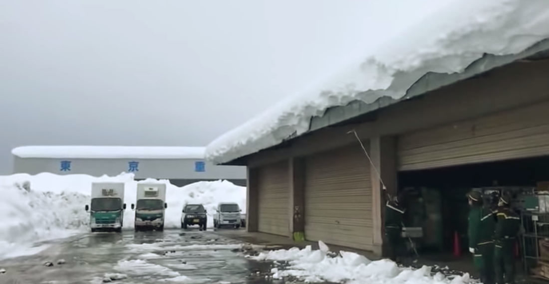 Watch A Massive Amount Of Snow Slide Off A Warehouse Roof At All Once