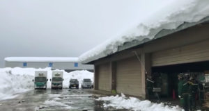 Watch A Massive Amount Of Snow Slide Off A Warehouse Roof At All Once