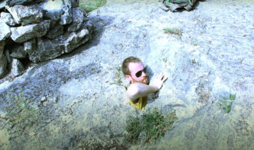 Nope: Adventurers Contorting Themselves Into Tiny Rock Hole To Explore Cave