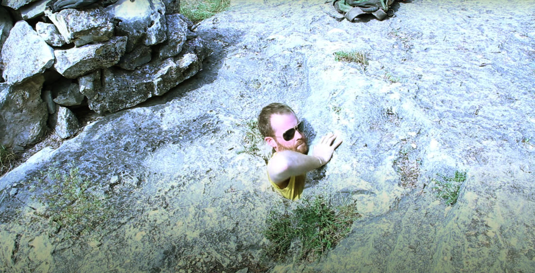 Nope: Adventurers Contorting Themselves Into Tiny Rock Hole To Explore Cave