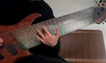 Man Demonstrates Playing His Ultrawide 14 String Electric Guitar