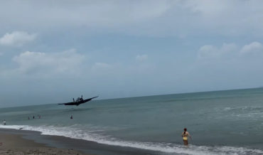 Coming In Hot!: WW2 Plane Lands In Ocean Right In Front Of Beachgoers After Engine Failure