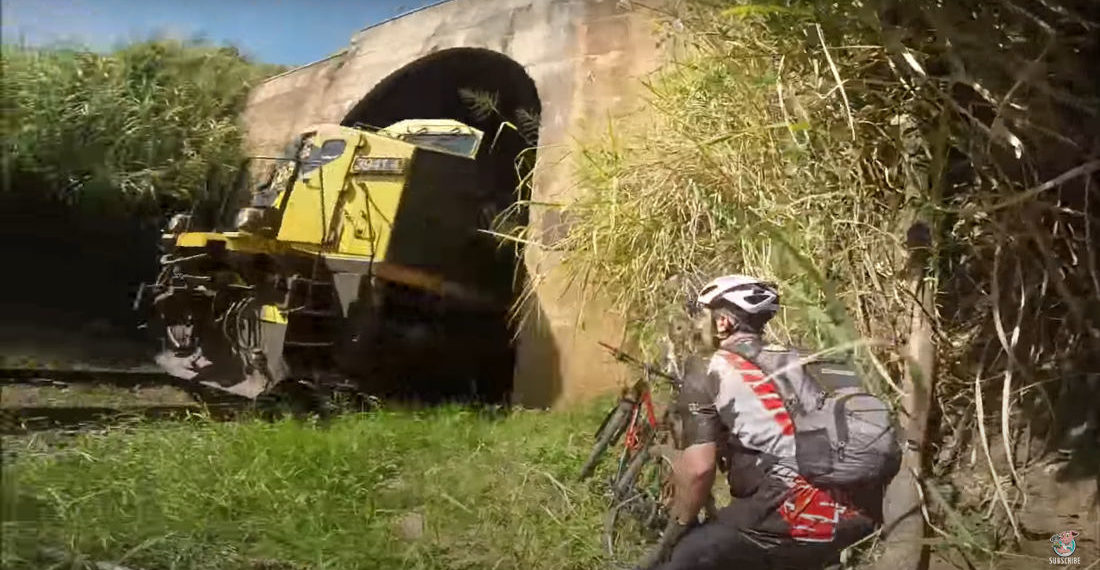 Cyclists Taking Shortcut Through Train Tunnel Almost Meet Train