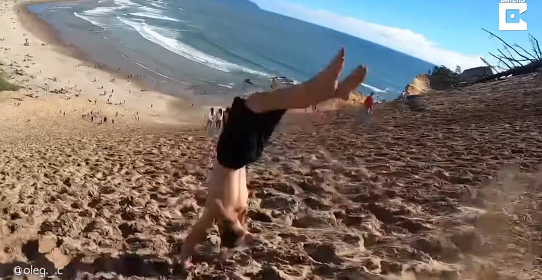 Holy Smokes: Man Performs Endless Backflips Down Steep Sand Bank