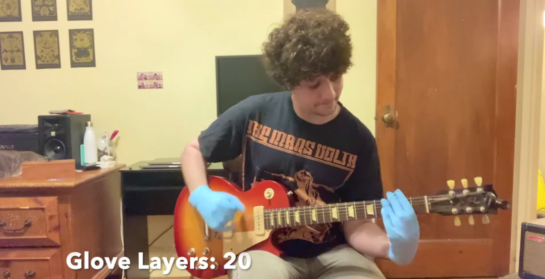 Playing Metallica’s ‘Enter Sandman’ Wearing More And More Layers Of Latex Gloves