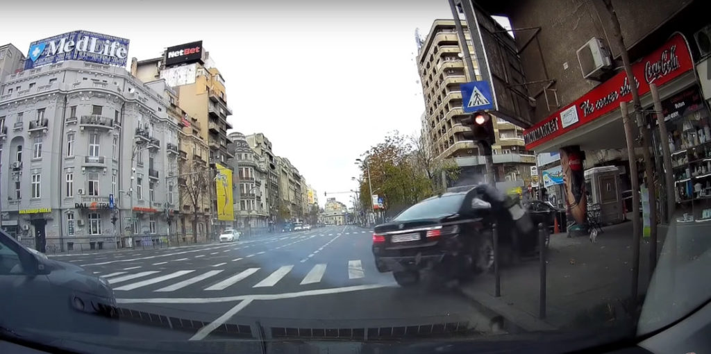 Romanian BMW Driver Crashes Hard Into Light Pole Trying To Evade Police