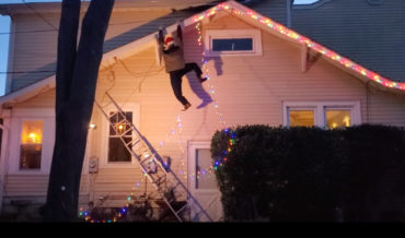 Clever Animated Man Dangling From Gutter Christmas Decoration