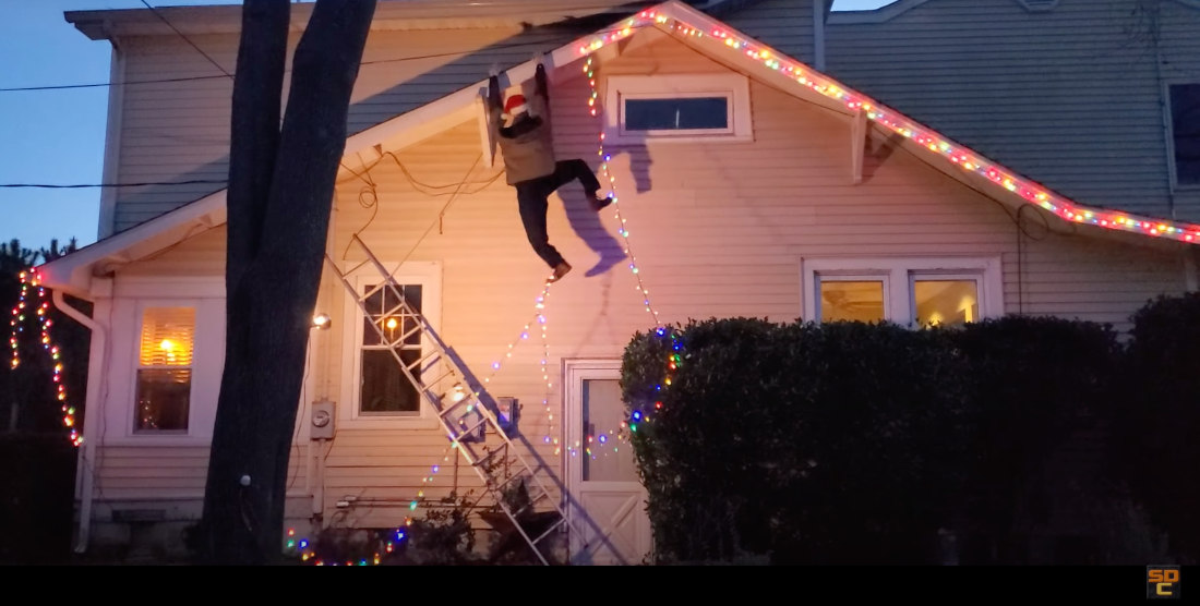 Clever Animated Man Dangling From Gutter Christmas Decoration
