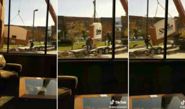 Coming In Hot!: Wind Blows Giant Building Sign Around During Installation