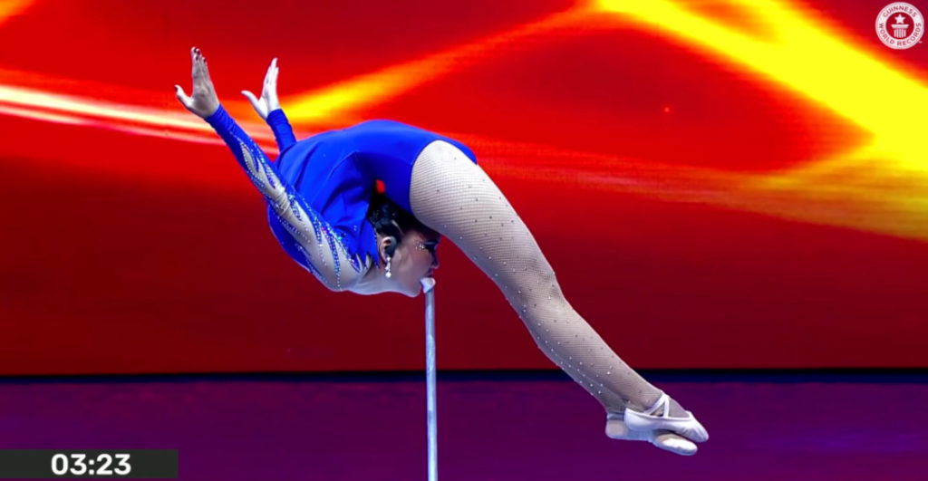 Contortionist Holds Mouth-Supported Marinelli Bend For 4m17s To Set New Record