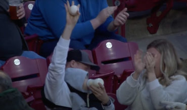 Man Bottle-Feeding Baby In Stands Casually Catches Foul Ball