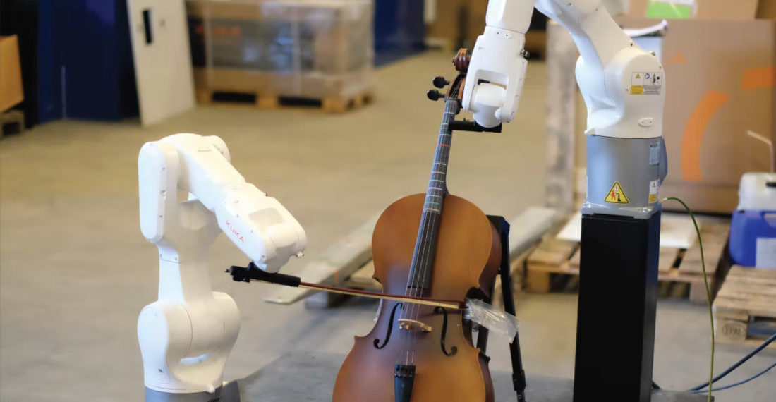 A Pair Of Robotic Arms Playing Stringed Instruments