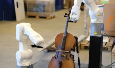 A Pair Of Robotic Arms Playing Stringed Instruments