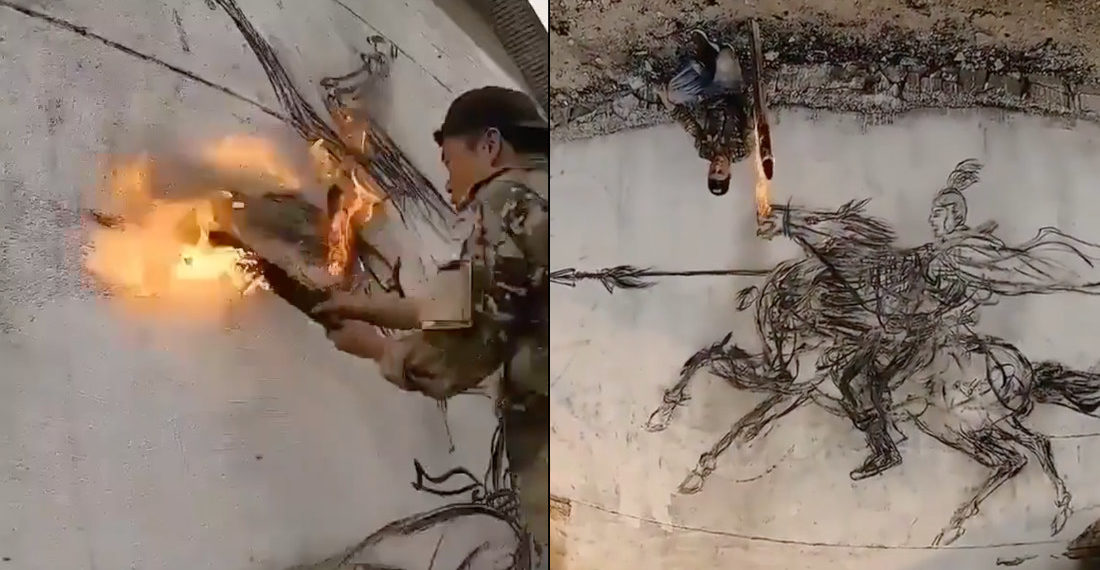 Man Sketches With Burning End Of A Flaming Stick