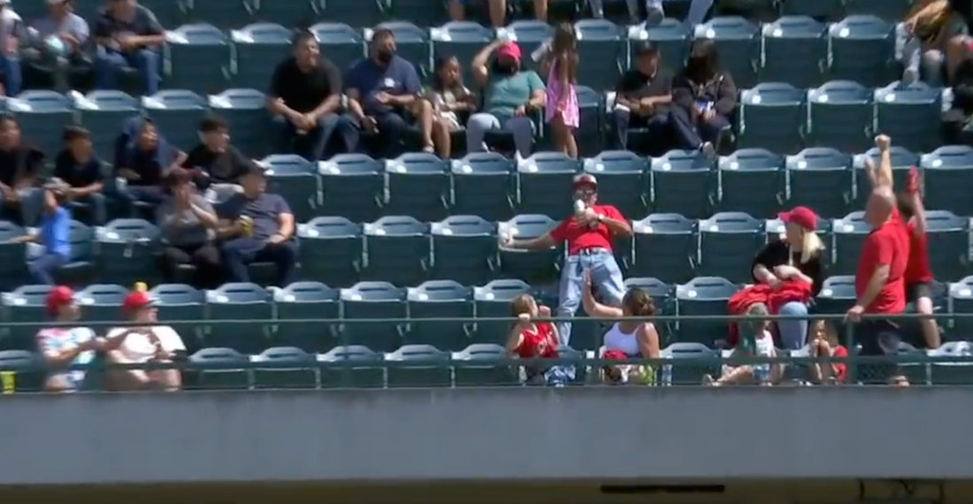 Angels Fan Makes Bare-Handed Foul Ball Catch While Holding Two Beers