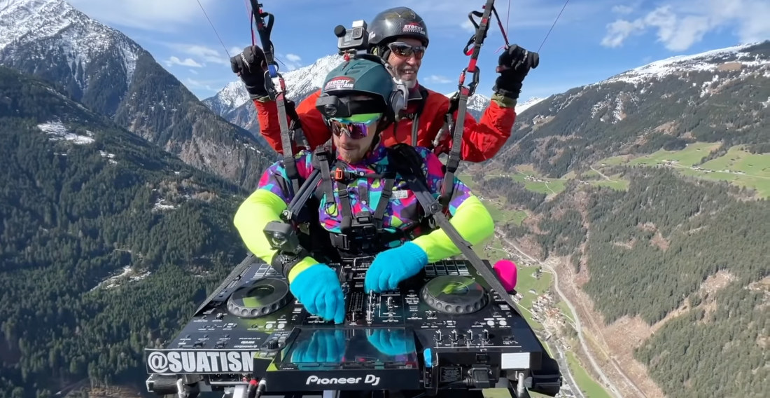 DJ Spins While Paragliding Over The Austrian Alps