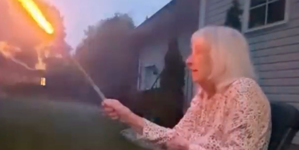 Grandma Holds Roman Candle For First Time