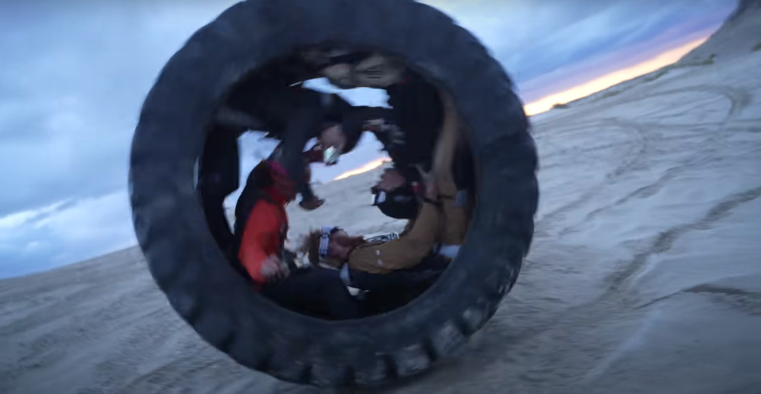 Four People Ride Down Hill Inside A 7-Foot Tire