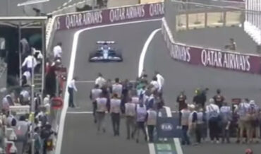 Photographers Almost Hit By F1 Car Coming In For Pit Stop
