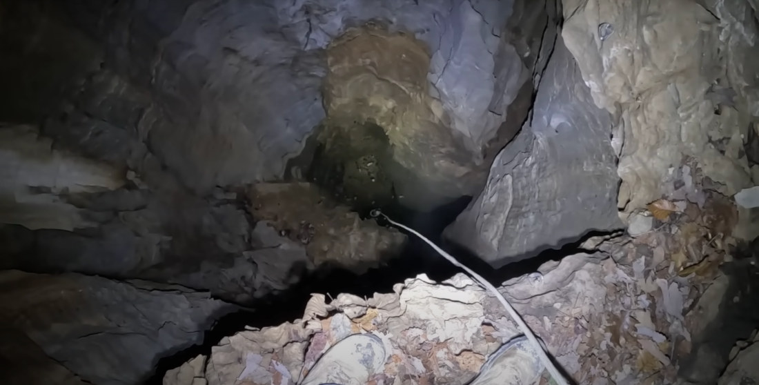 Adventurers Descend Into Tiny Hole In Forest, Revealing 220-Foot Sinkhole