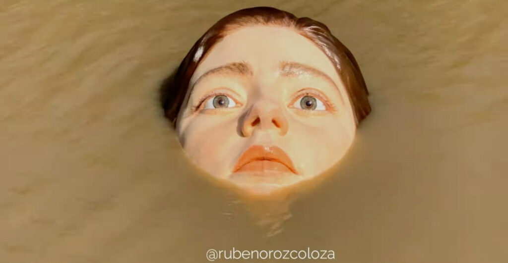 'The Drowning Girl', A Sculpture Of A Giant, Hyperrealistic Face In The River