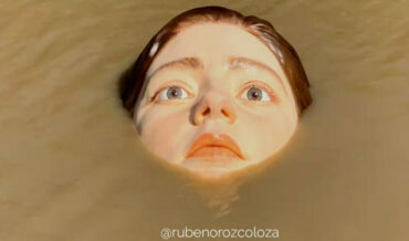 ‘The Drowning Girl’, A Sculpture Of A Giant, Hyperrealistic Face In The River