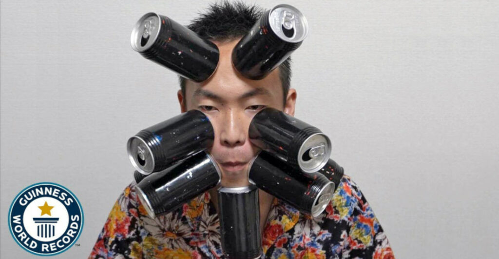 Man Attaches 9 Soda Cans To His Face With Suction To Set World Record