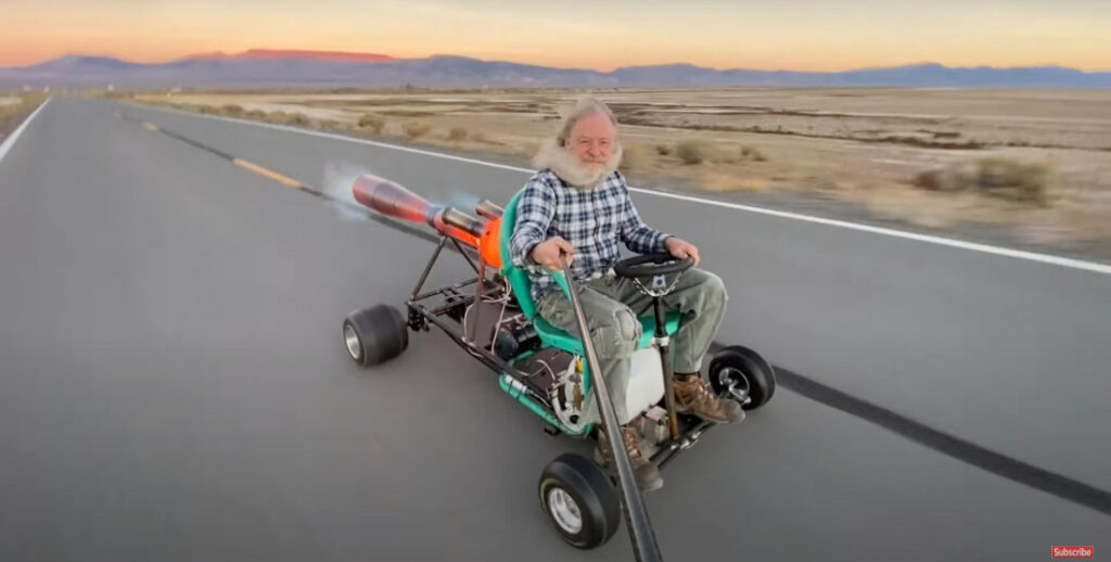 Rocketman Takes Green Lawn Chair Rocket Car For A Spin