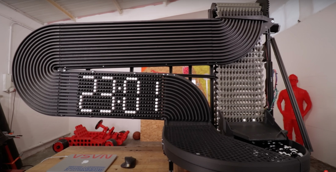 Giant Clock Tells Time With Dot Matrix Of Marbles