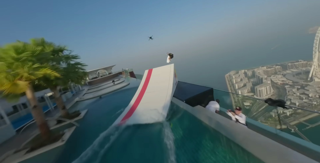 Drone-Towed Wakeboarder Launches Off Ramp In Dubai Rooftop Pool For BASE Jump
