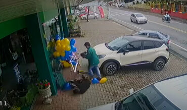 Bicyclist Crashes Into Balloon Display While Avoiding Car