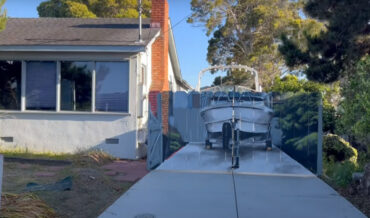 City Makes Man Build Fence To Hide Boat, He Has Realistic Replica Of Boat Painted On Fence