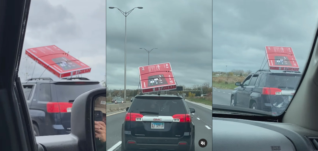 Flatscreen Strapped To Car Roof Desperately Trying To Fly