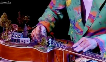 Masayoshi Takanaka Performs On Guitar With Functional Model Train