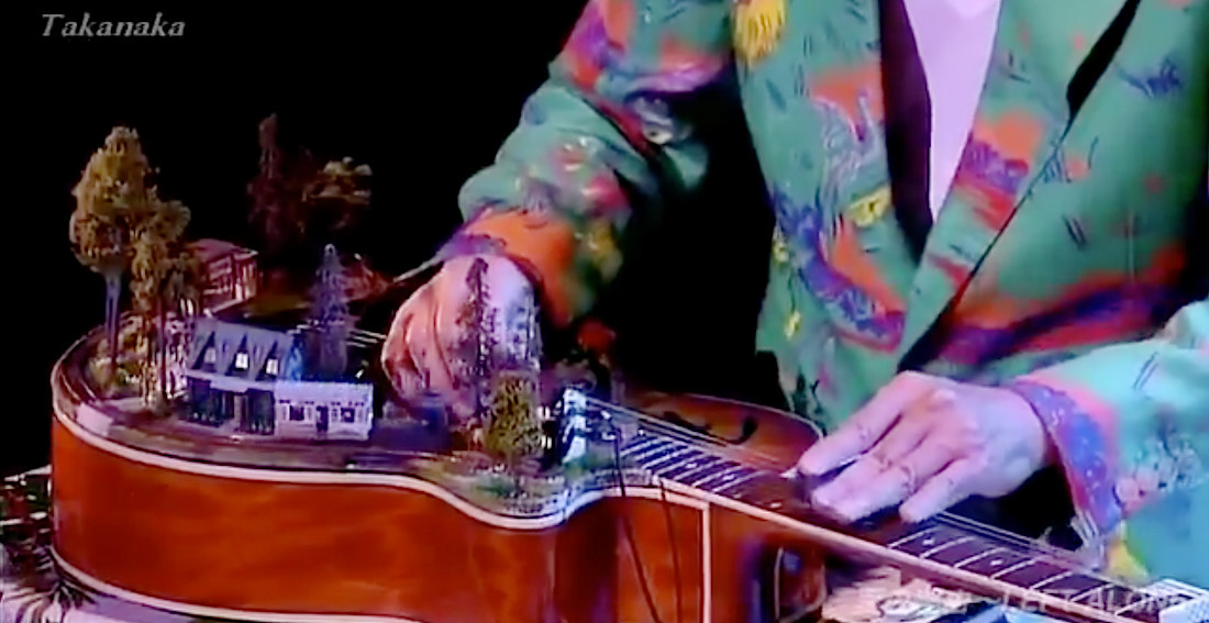 Masayoshi Takanaka Performs On Guitar With Functional Model Train