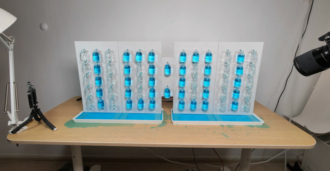 Analog Digital Clock Tells Time With Vials Of Colored Water