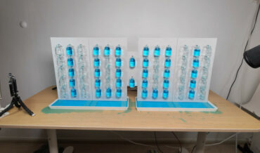 Analog Digital Clock Tells Time With Vials Of Colored Water