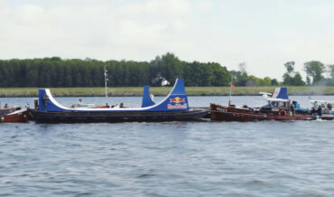 Backflipping Bike From One Boat To Another Traveling In Opposite Directions