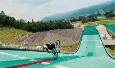 World Record For Riding A Bicycle Backwards Down A Ski Jump Slope On One Wheel